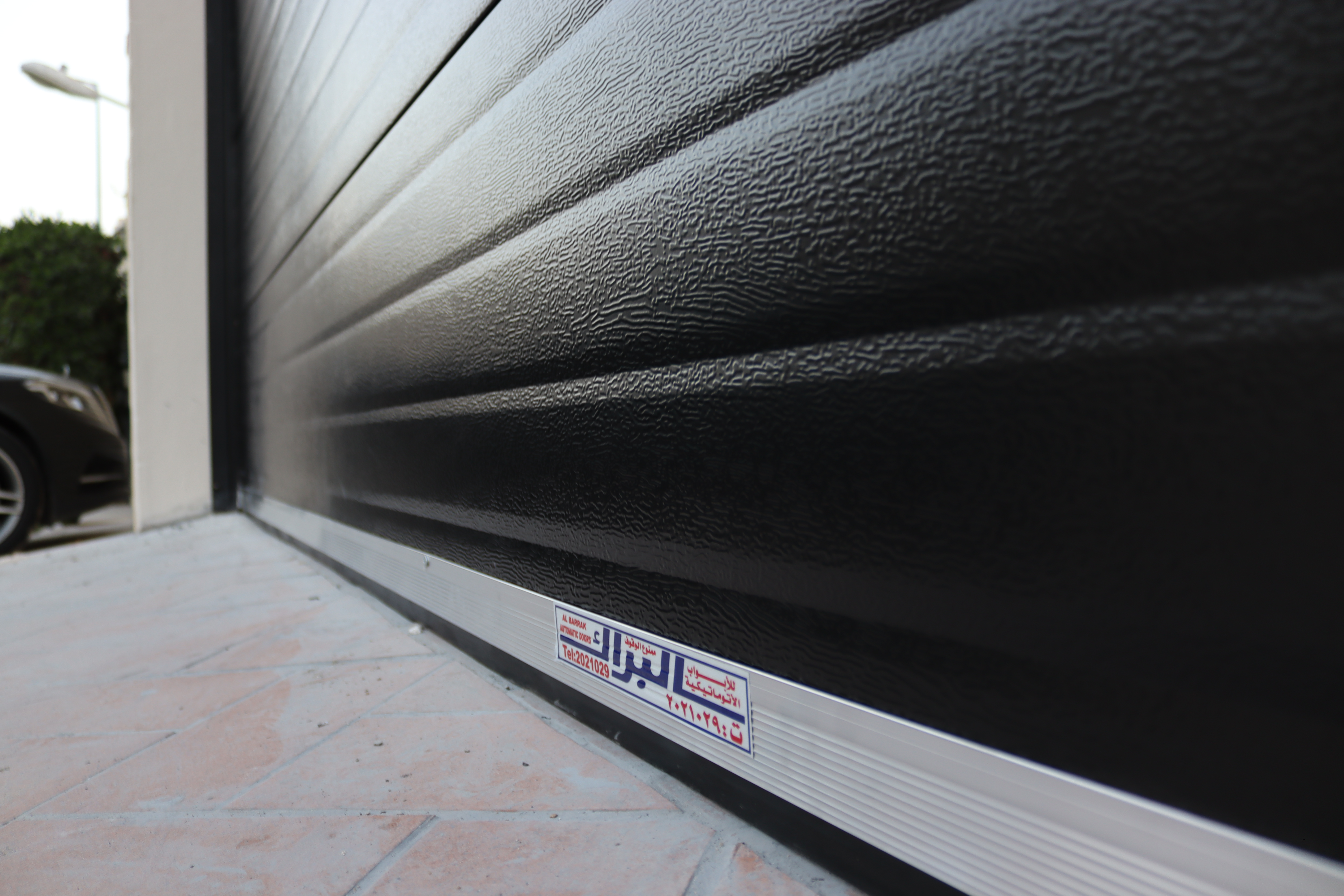 Residential roll-up garage door providing durability, and modern style